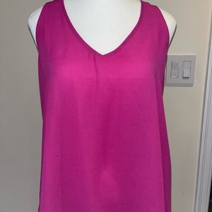 Very cute top flowing and light with lovely Chris cross in the back